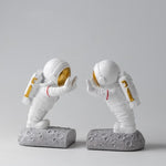 cale livre astronautes blanc et or pour vos étagères